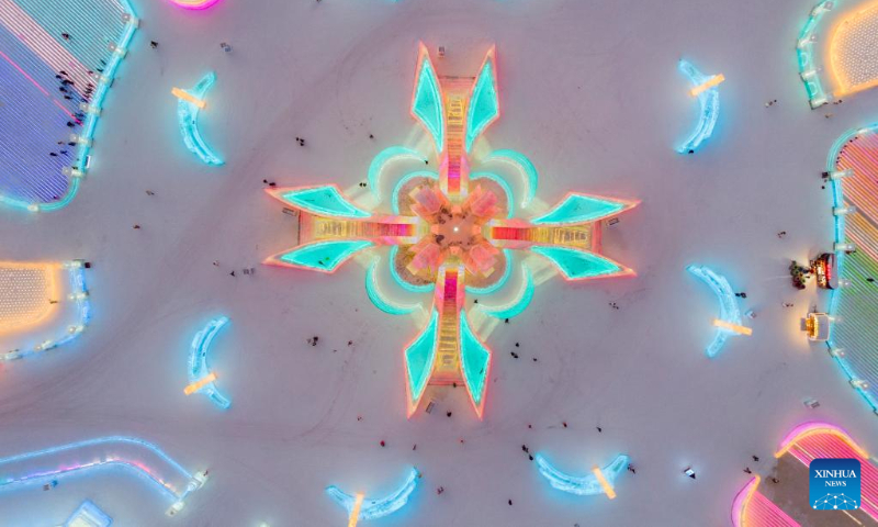 This aerial photo taken on Jan. 3, 2023 shows tourists visiting the Harbin Ice-Snow World in Harbin, northeast China's Heilongjiang Province. (Xinhua/Xie Jianfei)