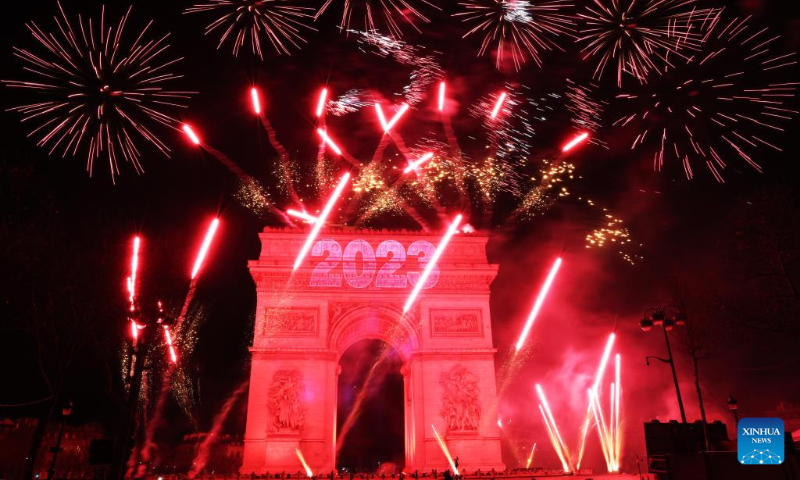 Fireworks illuminate the sky over the Arc de Triomphe during the New Year's celebrations on the Champs-Elysees Avenue in Paris, France, on Jan. 1, 2023. (Xinhua/Gao Jing)