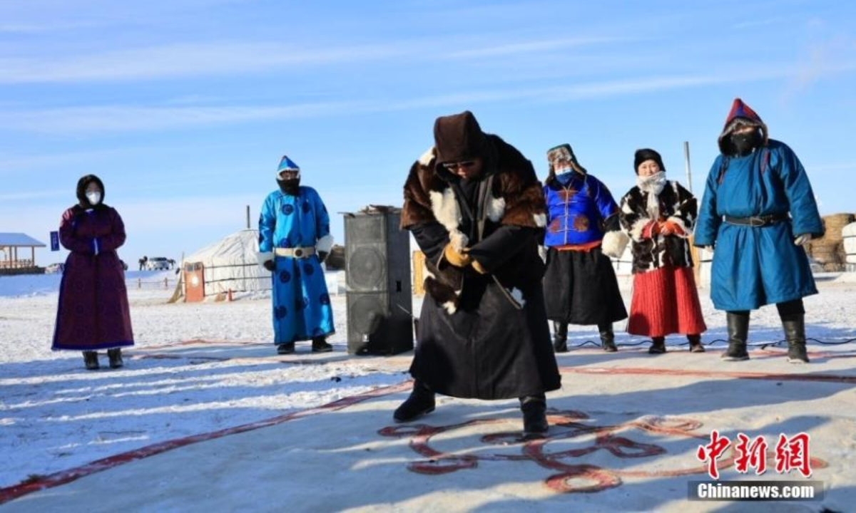 A herder takes part in a traditional Mongolian sport event during the winter Naadam festival in Hulunbuir, north China's Inner Mongolia Autonomous Region , Dec 22, 2022. Photo:China News Service