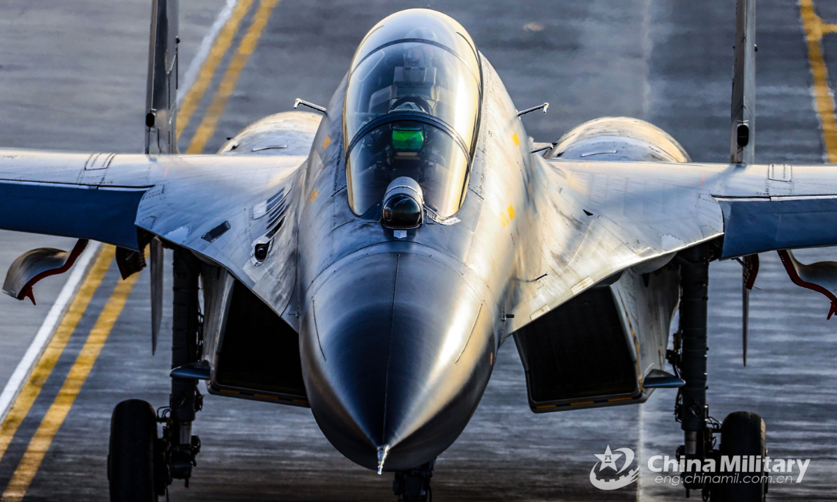 A fighter jet attached to an aviation brigade of the air force taxies on the runway to get ready for a flight training exercise on December 9, 2022. Photo:China Military