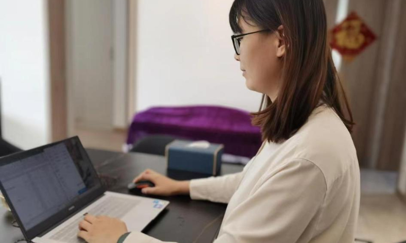 Doctor Kong Shujun works from home to provide medical consultations through online fever clinics of the internet hospital in east China's Shandong Province, Dec. 28, 2022. Photo: Xinhua