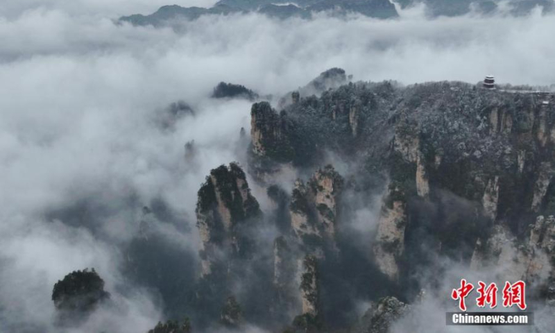 Rime covered Avatar mountain peaks are hidden in a sea of clouds at Tianzishan Scenic Area of Zhangjiajie, central China's Hunan Province, Jan. 1, 2023. (Photo: China News Service/Zhang Hongtao)