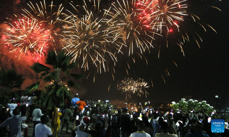 People watch fireworks to celebrate the New Year in Abidjan, Cote d'Ivoire, Jan. 1, 2023. (Photo by Yvan Sonh/Xinhua)