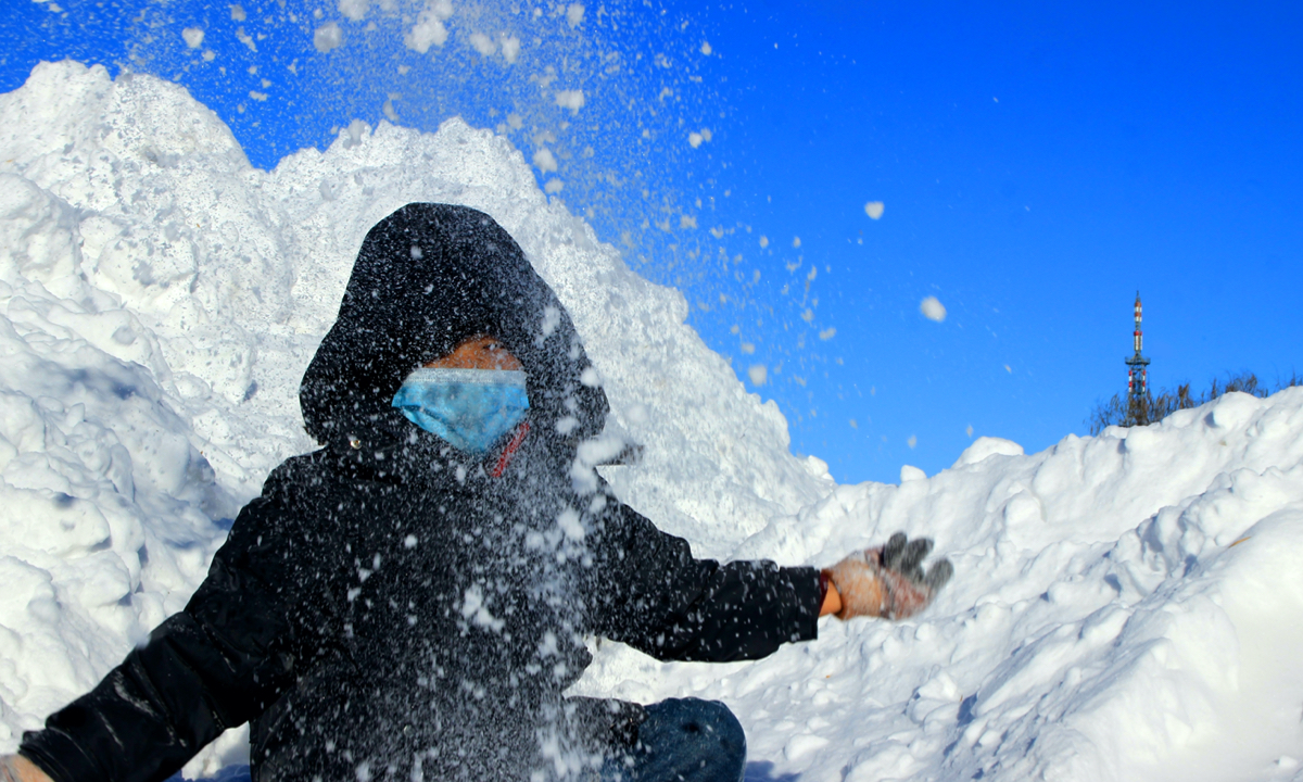 Resident stands in heavy snow in Tacheng city in Northwest China's Xinjiang Uygur Autonomous Region on November 28, 2022. Heavy snow hit the region in recent days as a cold wave gripped large parts of the country. The temperature in Tacheng fell to as low as -29 C. Photo: VCG