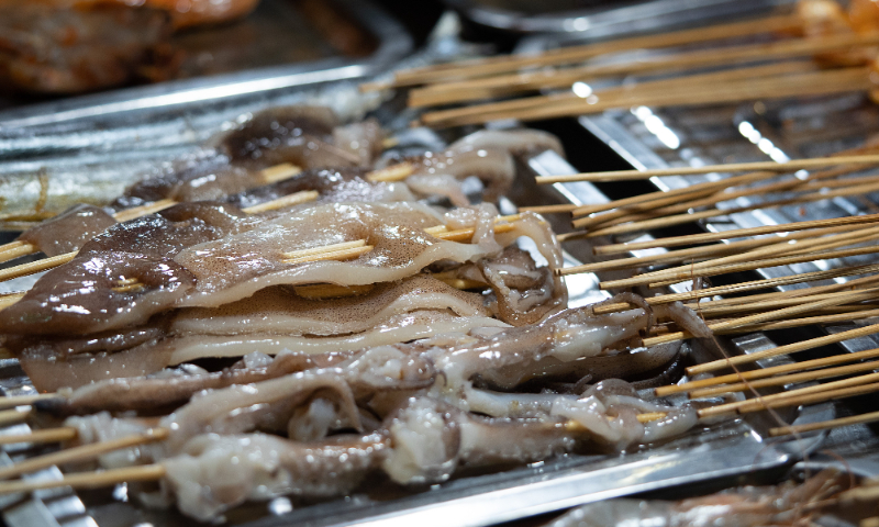 Squid is sold at a night market in Chengdu on February 1, 2022. Photo: VCG