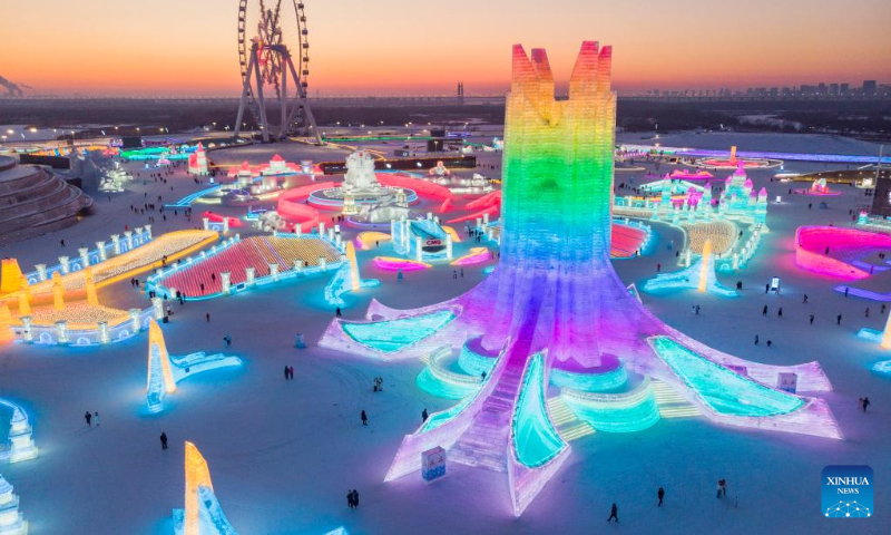 This aerial photo taken on Jan. 3, 2023 shows tourists visiting the Harbin Ice-Snow World in Harbin, northeast China's Heilongjiang Province. (Xinhua/Xie Jianfei)