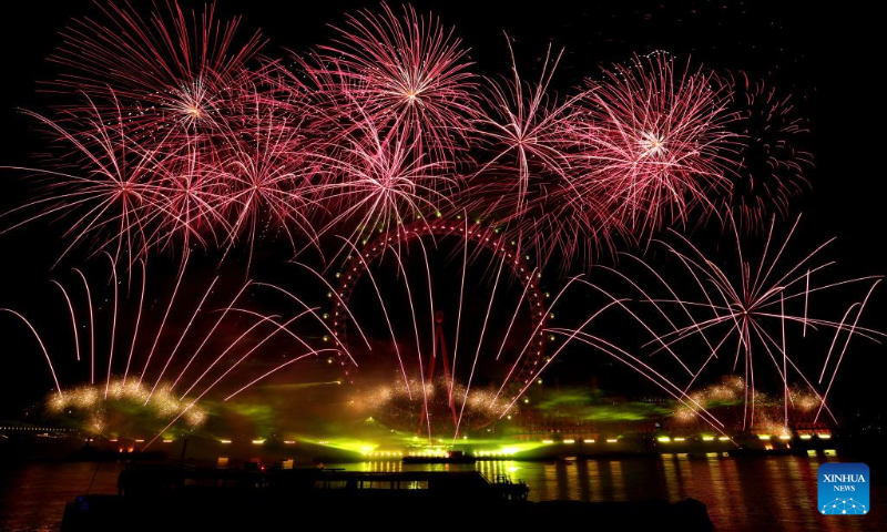 Fireworks explode over the London Eye during the New Year celebrations in London, Britain, on Jan. 1, 2023. (Xinhua/Li Ying)