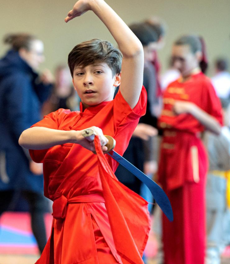 An athlete competes at the 8th Lithuanian Wushu (Kung Fu) Championship in Vilnius, Lithuania, on Dec. 10, 2022. The 8th Lithuanian Wushu (Kung Fu) Championship kicked off on Dec. 10, attracting nearly 100 competitors from Lithuania, Poland, Estonia, India and other countries to take part in. (Photo by Alfredas Pliadis/Xinhua)

