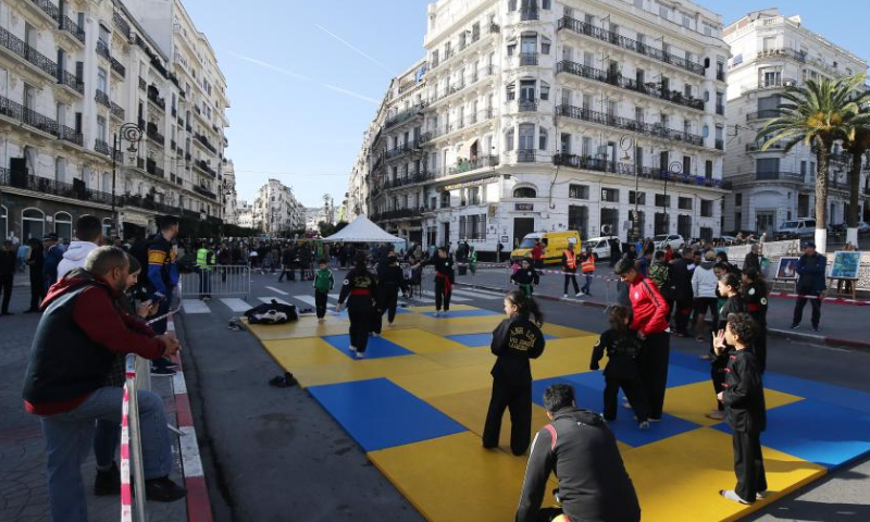 People take part in a car-free day event on a street in Algiers, Algeria, on Dec. 30, 2022. The car-free day event was held in downtown Algiers on Friday to raise public awareness about environment. Photo: Xinhua