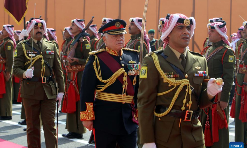 King Abdullah II of Jordan (C front) reviews the honor guards upon his arrival at the Parliament for the second ordinary session of Jordan's 19th parliament in Amman, Jordan, Nov. 13, 2022. King Abdullah II of Jordan on Sunday pledged continued support for the Palestinians, calling the Palestinian cause a top priority of his kingdom. Photo: Xinhua