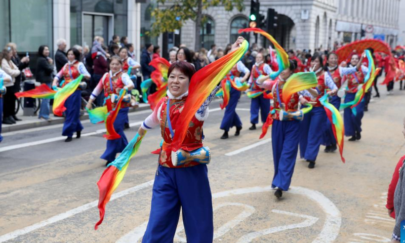 A team from the Zhejiang UK Association (ZJUKA) takes part in the Lord Mayor's Show in London, Britain, on Nov. 12, 2022. The annual Lord Mayor's Show was held Saturday in the City of London. Originating from the tradition that each year a new lord mayor is elected to represent the traditional business center of London and must travel from the City to Westminster to swear loyalty to the king or queen, the show has now become a carnival for residents. Photo: Xinhua