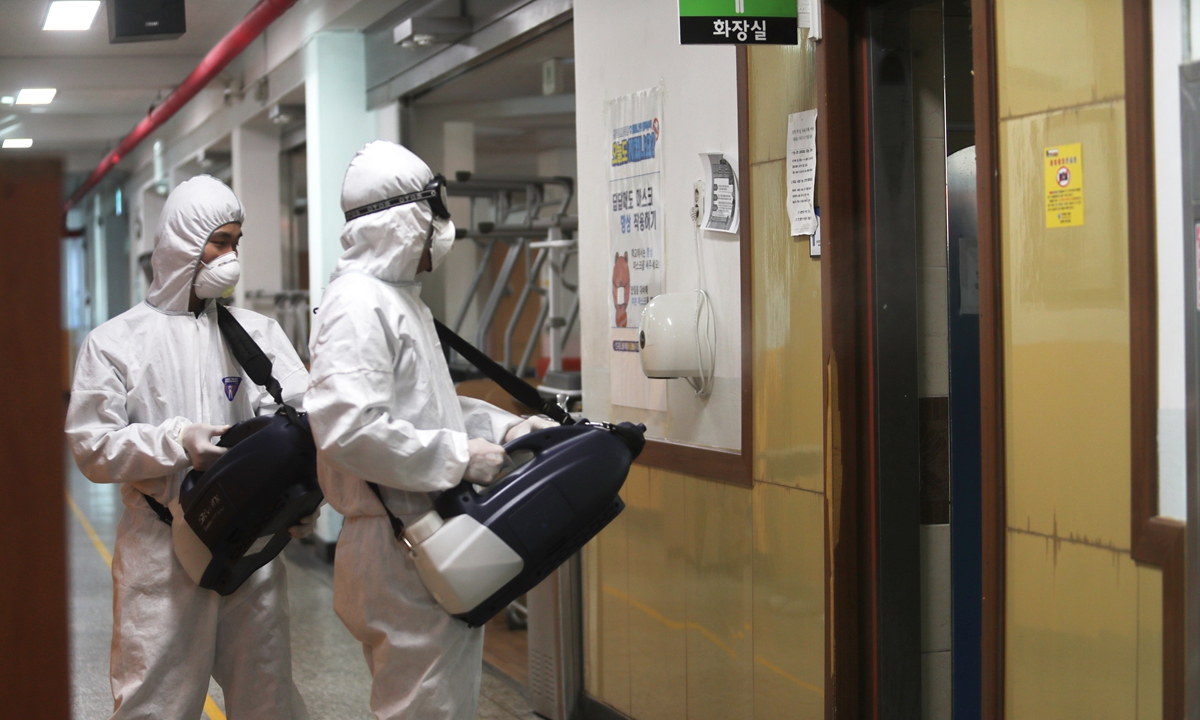 South Korean epidemic prevention workers disinfect a high school ahead of college entrance exams on November 15, 2022, Gwangju, South Korea. Seoul reported 72,883 new COVID-19 cases as of midnight Monday compared to 24 hours ago, health authorities said on November 15. Photo: VCG