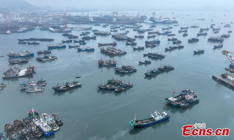 Fishing boats berth at a port in Rongcheng, east China's Shandong Province, Nov. 28, 2022. Shangdong issued a yellow alter for a cold wave on Monday. Fishing boats returned to the harbor to avoid cold weather and heavy waves. (Photo: China News Service/Li Xinjun) 


