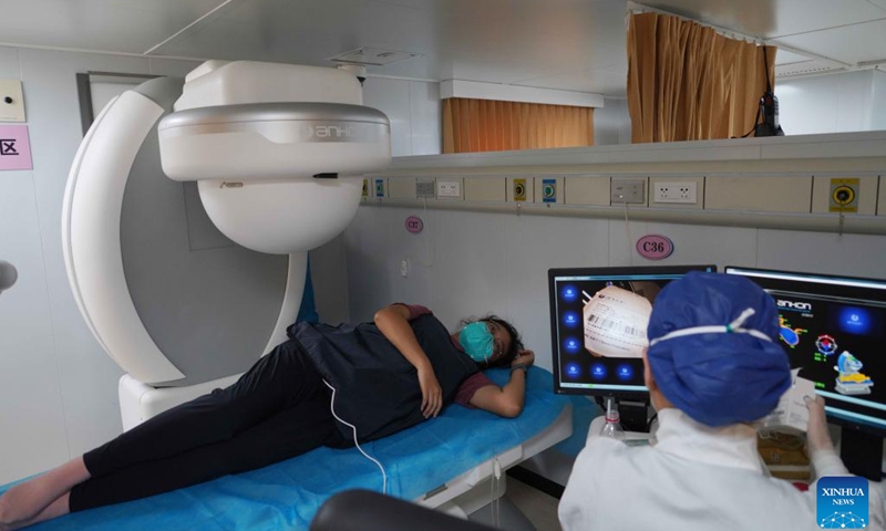 A doctor conducts medical examination for a local patient on the Chinese naval hospital ship Peace Ark during a medical mission in Jakarta, capital of Indonesia, Nov. 11, 2022. Chinese naval hospital ship Peace Ark arrived at a military port in Zhoushan, east China's Zhejiang Province, on Tuesday morning after successfully completing a medical mission in Jakarta, capital of Indonesia.(Photo: Xinhua)