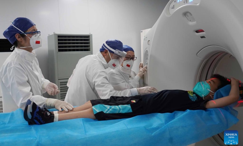 Doctors conduct medical examination for a child on the Chinese naval hospital ship Peace Ark during a medical mission in Jakarta, capital of Indonesia, Nov. 11, 2022. Chinese naval hospital ship Peace Ark arrived at a military port in Zhoushan, east China's Zhejiang Province, on Tuesday morning after successfully completing a medical mission in Jakarta, capital of Indonesia.(Photo: Xinhua)