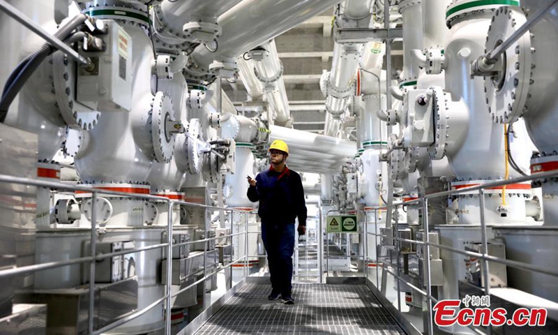 A staff member makes inspection at the Suwalong Hydropower station at the upstream of the Jinshajiang River at the intersection of the Mangkam County of Tibet and the Batang County of the Sichuan Province, Nov. 30, 2022. (Photo: China News Service/Wang Lei)


