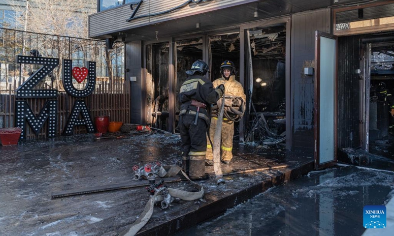 Firefighters are seen outside the burnt down Zuma restaurant in Vladivostok, Russia, on Dec. 7, 2022. The renowned Zuma restaurant was burnt down in a fire on Wednesday.(Photo: Xinhua)