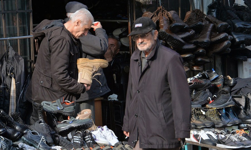People shop at a second-hand goods market in Ankara, Türkiye, Dec. 6, 2022.(Photo: Xinhua)
