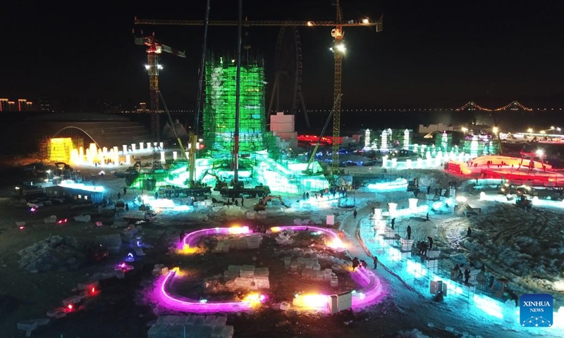 This aerial photo taken on Dec. 7, 2022 shows workers working at the construction site of the Harbin Ice-Snow World, a renowned seasonal theme park opening every winter, in Harbin, northeast China's Heilongjiang Province.(Photo: Xinhua)