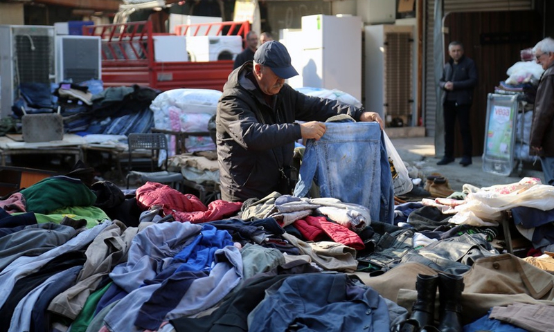 A man shops at a second-hand goods market in Ankara, Türkiye, Dec. 6, 2022.(Photo: Xinhua)