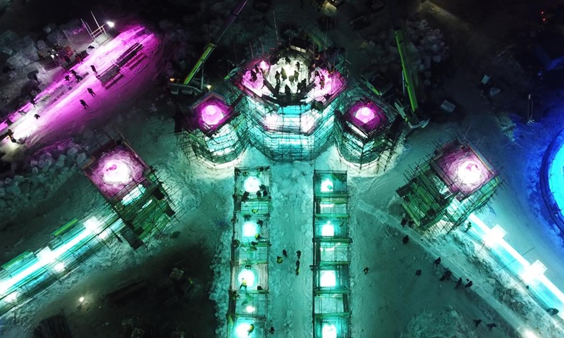 This aerial photo taken on Dec. 7, 2022 shows workers working at the construction site of the Harbin Ice-Snow World, a renowned seasonal theme park opening every winter, in Harbin, northeast China's Heilongjiang Province.(Photo: Xinhua)