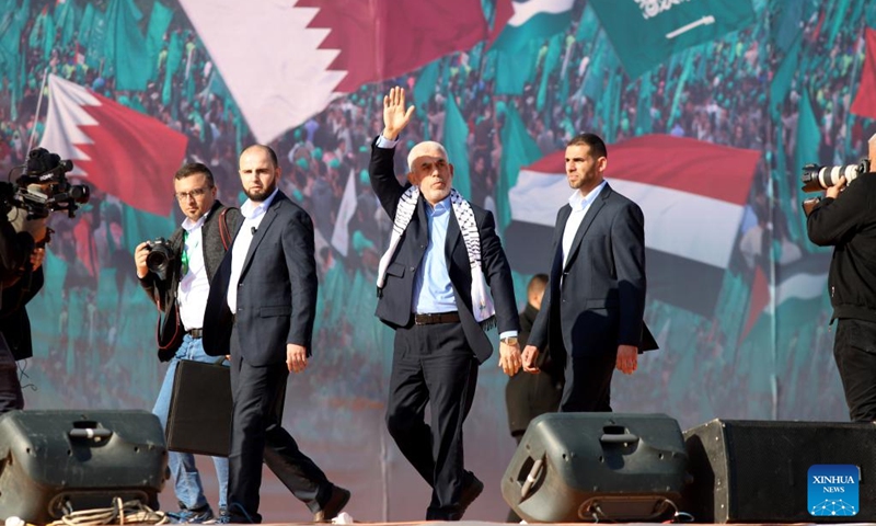 Yahya Sinwar (C), Hamas' leader in the Gaza Strip, waves to supporters at a rally marking the 35th anniversary of the establishment of the movement in Gaza City, on Dec. 14, 2022. The senior Hamas leader on Wednesday threatened to permanently end the prisoner exchange talks with Israel in response to the latter's continuous delay in them.(Photo: Xinhua)