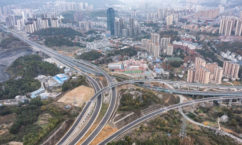 This aerial photo taken on Dec. 15, 2022 shows the Taoxi interchange of an expressway linking Renhuai City and Zunyi City in southwest China's Guizhou Province. The Renhuai-Zunyi Expressway was officially put into full operation on Friday. It reduces the road travel time between Renhuai and Zunyi from an hour and a half to 30 minutes.(Photo: Xinhua)