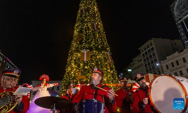 The Big Band of the Municipality of Athens plays Christmas songs at a Christmas event at Omonoia square in Athens, Greece, on Dec. 18, 2022.(Photo: Xinhua)