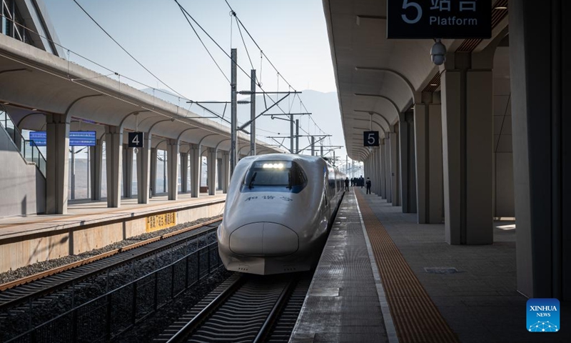 The first passenger train for official operation leaves Honghe Station along the Mile-Mengzi high-speed railway in Honghe Hani and Yi Autonomous Prefecture, southwest China's Yunnan Province, on Dec. 16, 2022. A high-speed railway, linking the cities of Mengzi and Mile in southwest China's Yunnan Province, entered operation on Friday. With a designed speed of 250 km per hour, the new railway has slashed the travel time between Mengzi and Kunming, the provincial capital, to 69 minutes.(Photo: Xinhua)