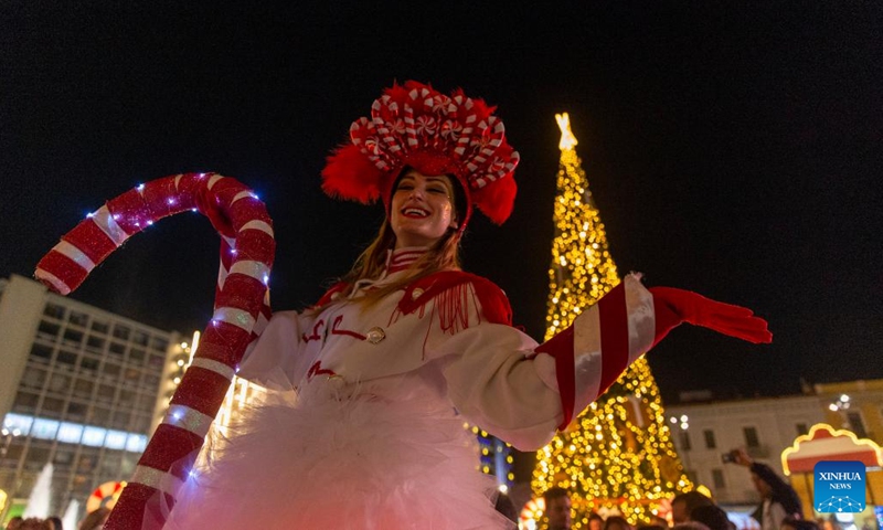 A performer attends a Christmas event at Omonoia square in Athens, Greece, on Dec. 18, 2022.(Photo: Xinhua)