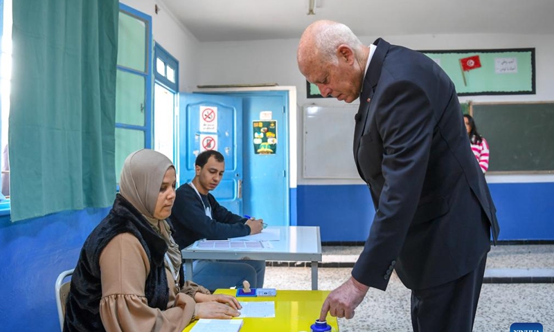 Tunisian President Kais Saied (1st R) registers at a polling station in Tunis, Tunisia on Dec. 17, 2022. Tunisians on Saturday started voting in legislative elections, with a total of 4,551 voting centers and 11,310 polling stations open in the Tunisian territory, the Independent High Authority for Elections (ISIE) said. (Tunisian Presidency/Handout via Xinhua)