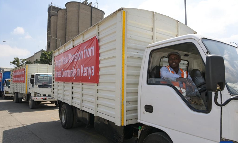 This photo taken on Dec. 17, 2022 shows the transport vehicles parked at the food donation ceremony site in Nairobi, capital of Kenya. (Xinhua/Han Xu)