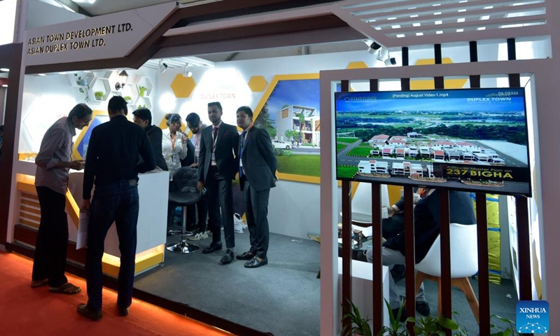 People attend a housing show in Dhaka, Bangladesh, on Dec. 21, 2022. The largest annual show of the apex body of Bangladesh's hundreds of realtors kicked off here on Wednesday to showcase flats, plots and other real estate and housing products.(Photo: Xinhua)