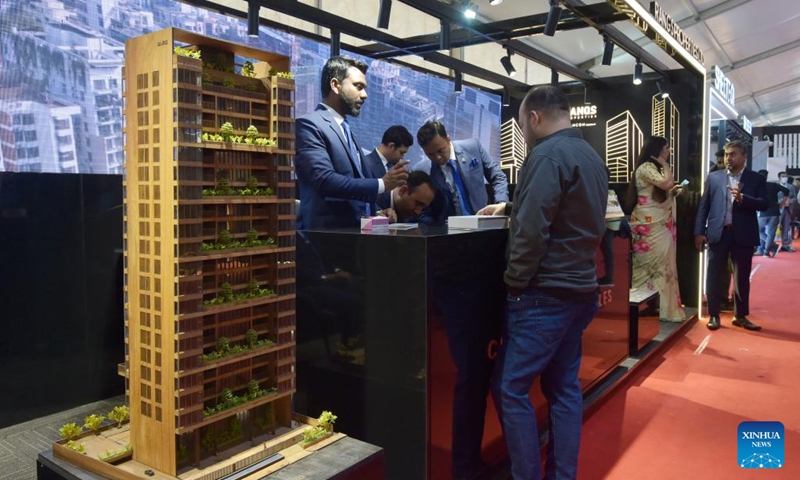 People attend a housing show in Dhaka, Bangladesh, on Dec. 21, 2022. The largest annual show of the apex body of Bangladesh's hundreds of realtors kicked off here on Wednesday to showcase flats, plots and other real estate and housing products.(Photo: Xinhua)