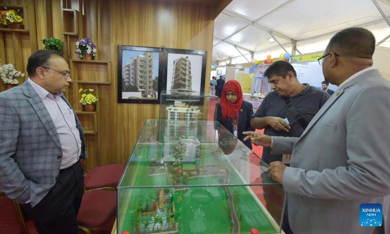 People attend a housing show in Dhaka, Bangladesh, on Dec. 21, 2022. The largest annual show of the apex body of Bangladesh's hundreds of realtors kicked off here on Wednesday to showcase flats, plots and other real estate and housing products.(Photo: Xinhua)