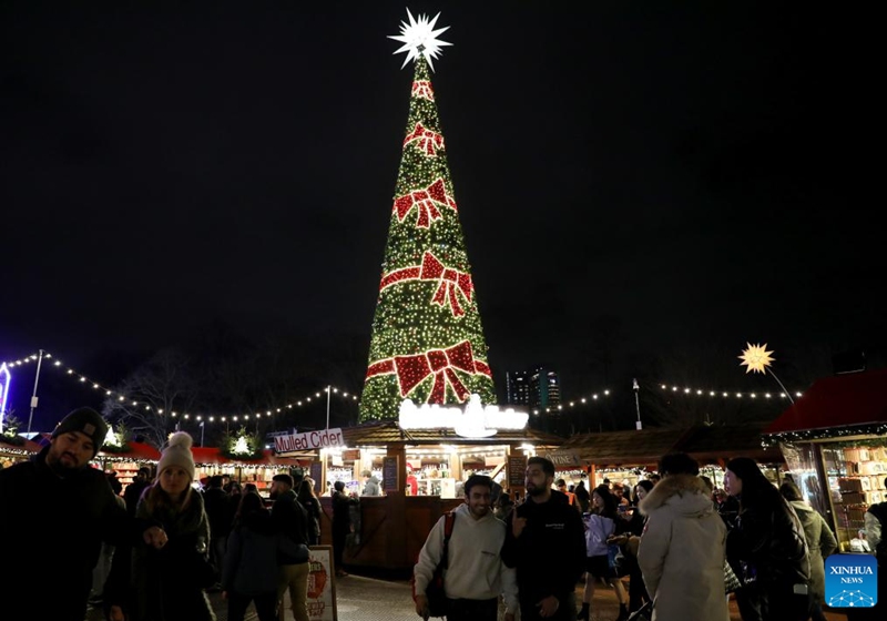 People celebrate Christmas Eve at Hyde Park Winter Wonderland Global