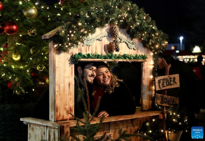 People visit Hyde Park Winter Wonderland on Christmas Eve in London, Britain, Dec. 24, 2022. (Xinhua/Li Ying)