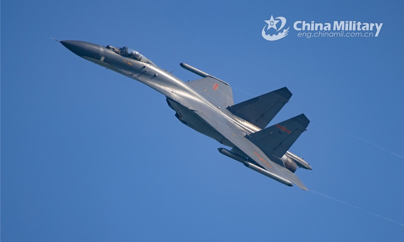 A fighter jet attached to an aviation brigade of the air force under the PLA Southern Theater Command fires rockets at mock ground targets during a live-fire training exercise on December 8, 2022. (eng.chinamil.com.cn/Photo by Liu Hang)