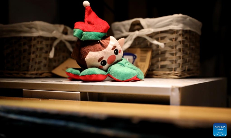 A toy is seen in a booth at Hyde Park Winter Wonderland on Christmas Eve in London, Britain, Dec. 24, 2022. (Xinhua/Li Ying)