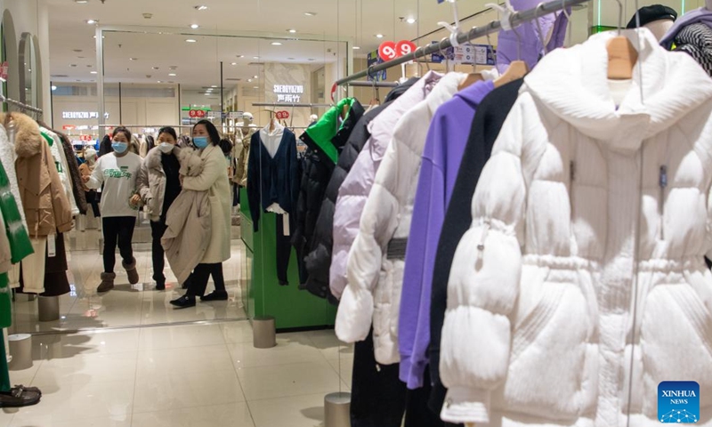 People visit Chongqing Department Store in Chongqing, southwest China, on Dec. 23, 2022. (Xinhua/Tang Yi)