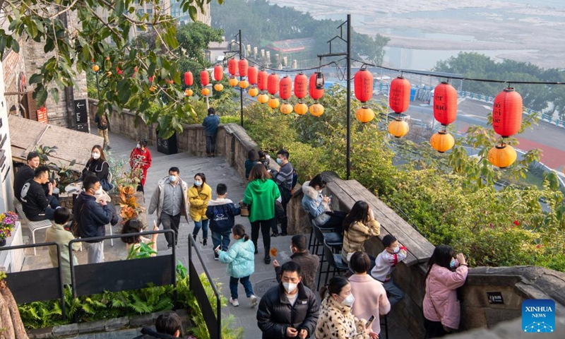 People visit Shancheng Alley of the Jiefangbei business district in Chongqing, southwest China, on Dec. 24, 2022. (Xinhua/Tang Yi)