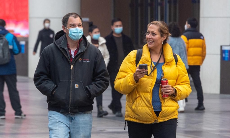 Tourists visit the Jiefangbei business district in Chongqing, southwest China, on Dec. 23, 2022. (Xinhua/Tang Yi)