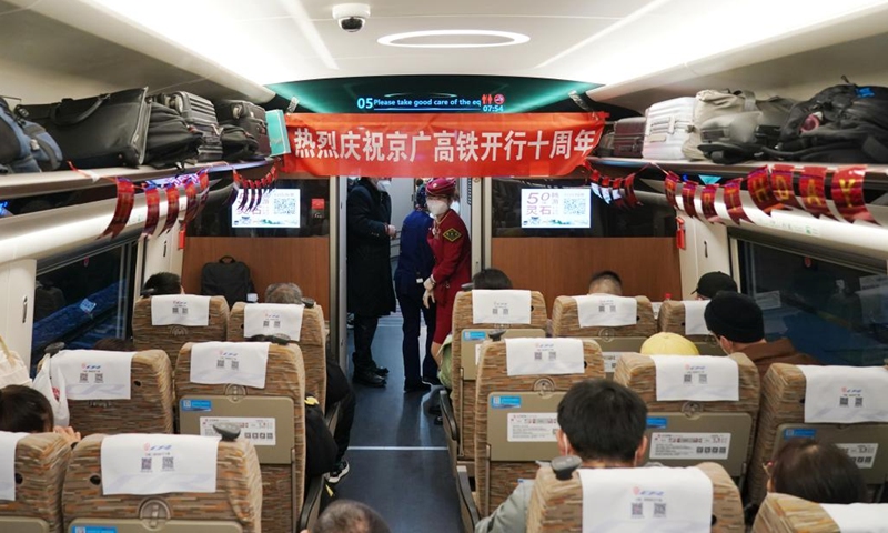 Passengers are seen on a bullet train at Beijing West Railway Station in Beijing, capital of China, Dec. 26, 2022. A total of 1.69 billion passenger trips have been made on the Beijing-Guangzhou high-speed railway since it went into operation ten years ago, official data showed.(Photo: Xinhua)