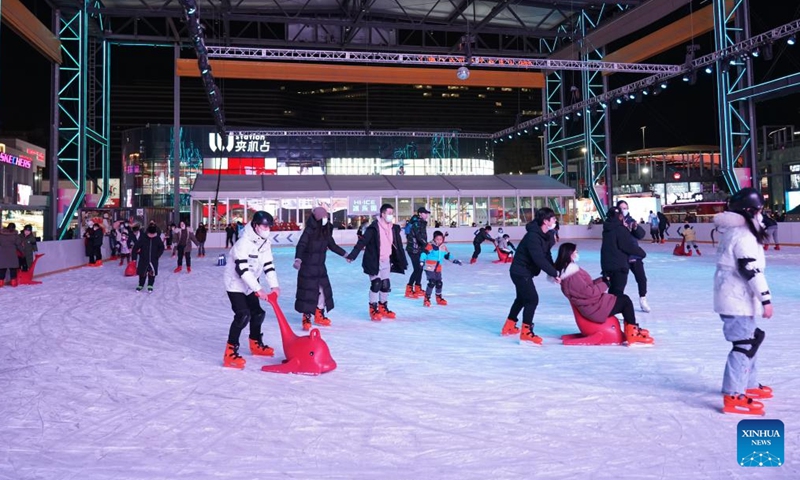 People skate at a business center in Beijing, capital of China, Dec. 25, 2022. In recent days, business areas in Beijing have resumed bustle in the face of the COVID-19, as effective measures are taken to resume working of enterprises and promote consumption.(Photo: Xinhua)