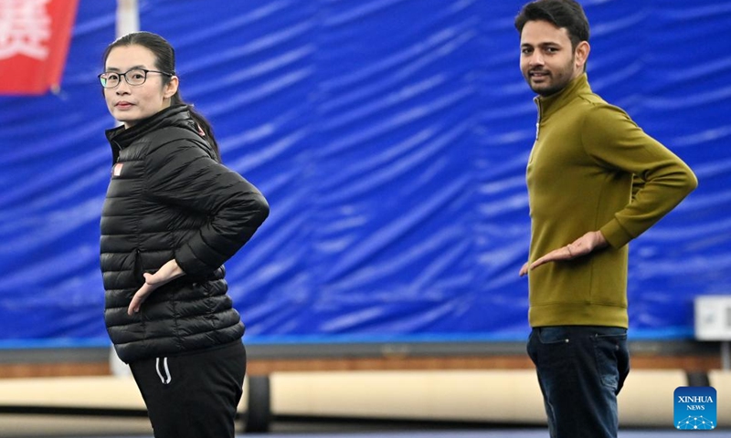 Muhammad Nabil (R) practices Huo-style boxing with Huo Jinghong at a martial arts gym in Xiqing District, north China's Tianjin, Dec. 25, 2022. Muhammad Nabil is a Pakistani student at Nankai University in Tianjin. In 2018, he chose to come to Tianjin to study for his Ph.D., not only to achieve quality education here, but also to fulfill his dream to chase the Chinese martial arts, or Kung Fu.(Photo: Xinhua)