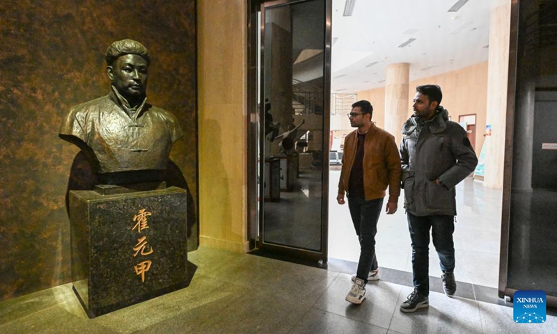 Muhammad Nabil (R) visits a memorial hall commemorating Kung Fu legend Huo Yuanjia with his friend in Jingwu Town of Xiqing District in north China's Tianjin, Dec. 25, 2022. Muhammad Nabil is a Pakistani student at Nankai University in Tianjin. In 2018, he chose to come to Tianjin to study for his Ph.D., not only to achieve quality education here, but also to fulfill his dream to chase the Chinese martial arts, or Kung Fu.(Photo: Xinhua)