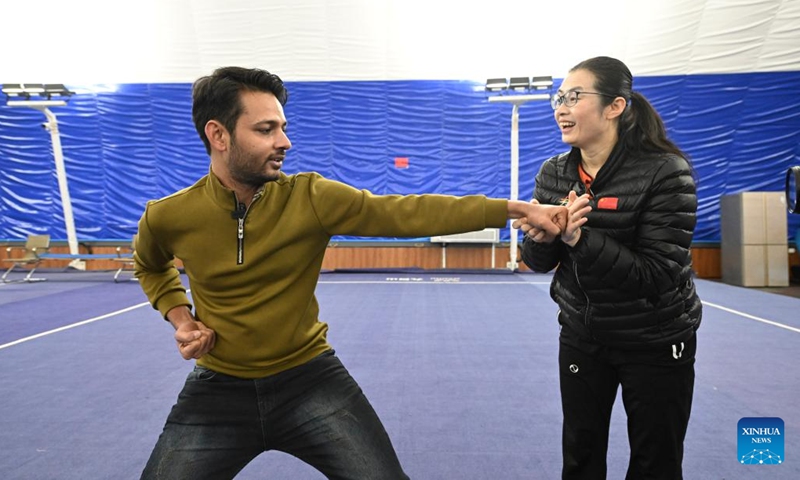 Muhammad Nabil (L) learns Huo-style boxing from Huo Jinghong at a martial arts gym in Xiqing District, north China's Tianjin, Dec. 25, 2022. Muhammad Nabil is a Pakistani student at Nankai University in Tianjin. In 2018, he chose to come to Tianjin to study for his Ph.D., not only to achieve quality education here, but also to fulfill his dream to chase the Chinese martial arts, or Kung Fu.(Photo: Xinhua)