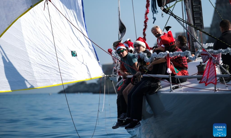 People take part in the traditional Boxing Day Fun Race for charity in Ta' Xbiex, Malta, on Dec. 26, 2022.(Photo: Xinhua)