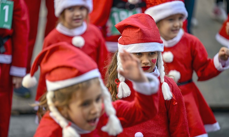 Children dressed as Santa Clauses take part in the traditional Santa race in Skopje, North Macedonia, on Dec. 25, 2022.(Photo: Xinhua)