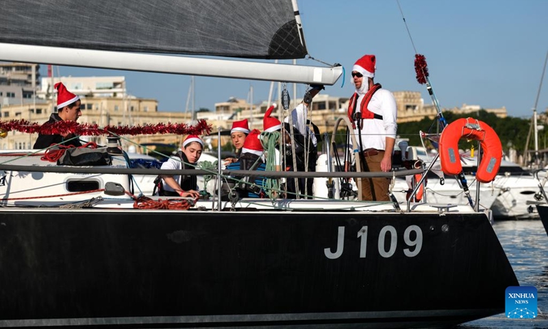 People take part in the traditional Boxing Day Fun Race for charity in Ta' Xbiex, Malta, on Dec. 26, 2022.(Photo: Xinhua)